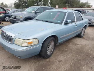 2010 Mercury Grand Marquis LS with VIN 2MEBM7FV0AX613519, listed as a IAAI auction lot 41582646 with 201,854 mi miles. Bid and sale history available at carsss.com. Image 2.