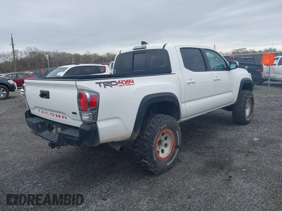 2023 Toyota Tacoma SR with VIN 3TMCZ5AN2PM641846, listed as a IAAI auction lot 41948660 with 21,969 mi miles and . Bid and sale history available at DreamBid. Image 4.