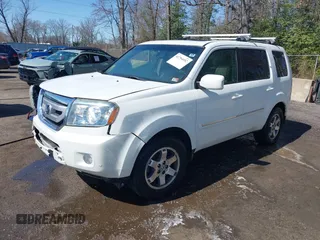2011 Honda Pilot Touring with VIN 5FNYF4H96BB014095, listed as a IAAI auction lot 41794052 with 202,440 mi miles and . Bid and sale history available at DreamBid. Image 2.