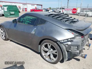 2012 Nissan 370Z z VIN JN1AZ4EH6CM561397, wystawiony jako IAAI lot #41812673 z przebiegiem 53 861 mil mil oraz . Historia ofert i sprzedaży dostępna na DreamBid. Obrazek 3.