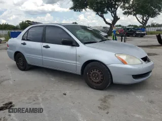 2006 Mitsubishi Lancer with VIN JA3AJ16E56U005818, listed as a Copart auction lot 60749615 with 155,194 mi miles and Salvage title. Bid and sale history available at DreamBid. Image 4.