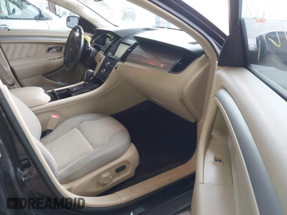 2015 Ford Taurus SEL z VIN 1FAHP2E86FG165100, wystawiony jako IAAI lot #42157272 z przebiegiem 141 846 mil mil oraz . Historia ofert i sprzedaży dostępna na DreamBid. Obrazek 5.