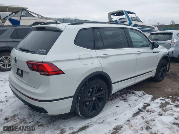 2023 Volkswagen Tiguan SE R-Line Black with VIN 3VVCB7AX6PM132085, listed as a IAAI auction lot 41278065 with 24,333 mi miles. Bid and sale history available at carsss.com. Image 4.