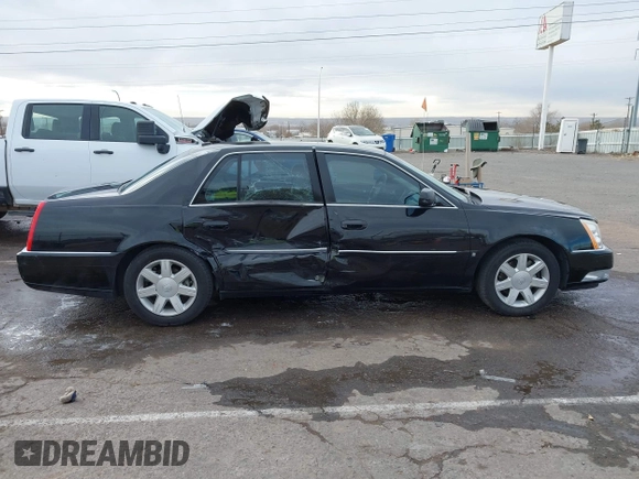 2006 Cadillac DTS w/1SC with VIN 1G6KD57Y96U251691, listed as a IAAI auction lot 41086147 with 128,959 mi miles. Bid and sale history available at carsss.com. Image 13.