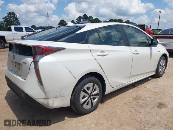 2017 Toyota Prius Two with VIN JTDKARFUXH3040780, listed as a IAAI auction lot 42091493 with 105,952 mi miles and . Bid and sale history available at DreamBid. Image 4.