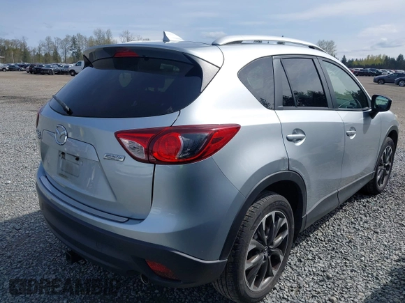 2016 Mazda CX-5 Grand Touring with VIN JM3KE4DYXG0647802, listed as a IAAI auction lot 41996854 with 85,774 mi miles. Bid and sale history available at carsss.com. Image 4.