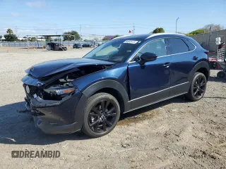 2023 Mazda CX-30 S Premium z VIN 3MVDMBDM7PM543849, wystawiony jako Copart lot #54852415 z przebiegiem 20 898 mil mil oraz Szkoda całkowita • Salvage title. Historia ofert i sprzedaży dostępna na DreamBid. Obrazek 1.