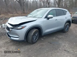 2021 Mazda CX-5 Touring with VIN JM3KFBCM9M1329806, listed as a IAAI auction lot 41825123 with 59,300 mi miles. Bid and sale history available at carsss.com. Image 17.