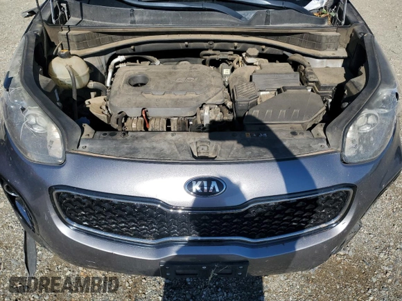 2017 Kia Sportage LX z VIN KNDPMCACXH7068094, wystawiony jako Copart lot #56706805 z przebiegiem 119 304 mil mil oraz Szkoda całkowita • Salvage title. Historia ofert i sprzedaży dostępna na DreamBid. Obrazek 11.