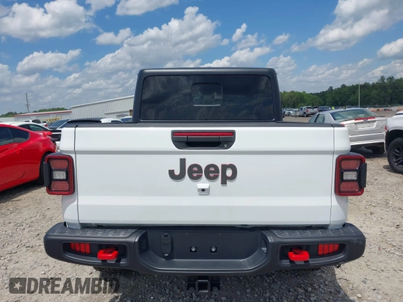 2024 Jeep Gladiator Rubicon z VIN 1C6JJTBG5RL110865, wystawiony jako IAAI lot #42104829 z przebiegiem 6 815 mil mil oraz . Historia ofert i sprzedaży dostępna na DreamBid. Obrazek 16.