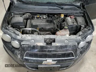 2012 Chevrolet Sonic LTZ z VIN 1G1JE5SH3C4151930, wystawiony jako Copart lot #84337574 z przebiegiem 125 606 mil mil oraz Szkoda całkowita • Salvage title. Historia ofert i sprzedaży dostępna na DreamBid. Obrazek 11.
