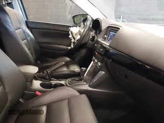 2014 Mazda CX-5 Grand Touring with VIN JM3KE4DY9E0373974, listed as a IAAI auction lot 42073693 with 86,755 mi miles. Bid and sale history available at carsss.com. Image 5.
