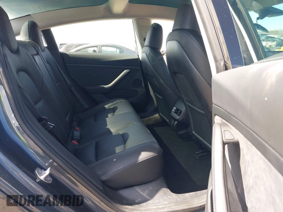 2023 Tesla Model 3 with VIN 5YJ3E1EAXPF652089, listed as a IAAI auction lot 42666520 with 17,679 mi miles and . Bid and sale history available at DreamBid. Image 8.