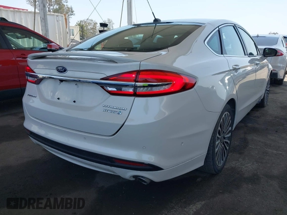 2017 Ford Fusion Hybrid Titanium with VIN 3FA6P0RU8HR229653, listed as a IAAI auction lot 42445182 with 163,279 mi miles and . Bid and sale history available at DreamBid. Image 4.
