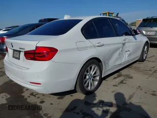 2016 BMW 3 Series 320i with VIN WBA8A9C59GK615704, listed as a IAAI auction lot 41431347 with 76,827 mi miles. Bid and sale history available at carsss.com. Image 4.