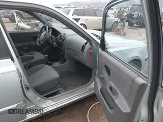 2003 Hyundai Accent GL with VIN KMHCG45C43U465523, listed as a IAAI auction lot 40883056 with 95,770 mi miles. Bid and sale history available at carsss.com. Image 5.