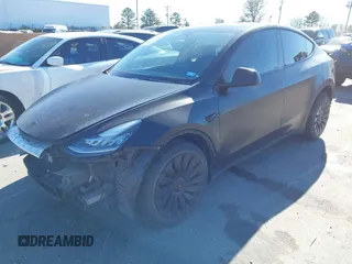 2022 Tesla Model Y Long Range with VIN 7SAYGDEEXNF424856, listed as a IAAI auction lot 41059718 with 44,439 mi miles and . Bid and sale history available at carsss.com. Image 2.