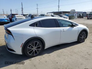2024 Toyota Prius LE z VIN JTDACAAU7R3016159, wystawiony jako Copart lot #57879835 z przebiegiem 22 184 mil mil oraz Szkoda całkowita • Salvage title. Historia ofert i sprzedaży dostępna na DreamBid. Obrazek 3.