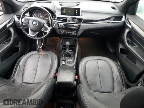 2017 BMW X1 sDrive28i with VIN WBXHU7C3XH5H38074, listed as a Copart auction lot 43088995 with 98,820 mi miles and Salvage Title. Bid and sale history available at carsss.com. Image 8.