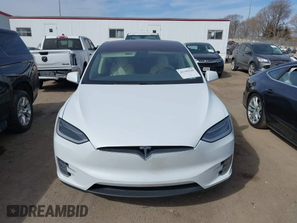 2018 Tesla Model X 75D with VIN 5YJXCBE27JF121834, listed as a IAAI auction lot 41769246 with 90,814 mi miles and . Bid and sale history available at carsss.com. Image 12.