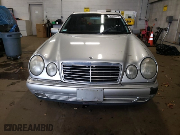 1999 Mercedes-Benz E-Class with VIN WDBJF82H4XX021888, listed as a Copart auction lot 83069274 with 173,198 mi miles and Salvage Title. Bid and sale history available at carsss.com. Image 5.