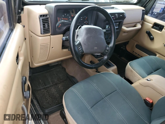 2002 Jeep Wrangler Sahara with VIN 1J4FA59S22P771136, listed as a Copart auction lot 51528665 with 236,882 mi miles and Salvage title. Bid and sale history available at DreamBid. Image 8.