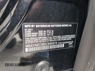 2013 BMW 7 Series 740i with VIN WBAYA6C58DC994974, listed as a Copart auction lot 55534645 with 106,975 mi miles and Salvage title. Bid and sale history available at DreamBid. Image 12.