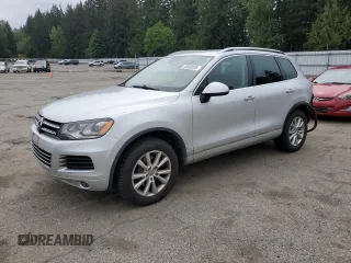 2014 Volkswagen Touareg Sport with VIN WVGEF9BP5ED003281, listed as a Copart auction lot 56458195 with 137,538 mi miles and Salvage title. Bid and sale history available at DreamBid. Image 1.