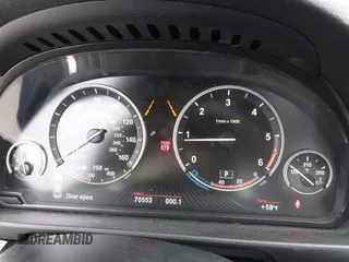 2014 BMW 5 Series 535d with VIN WBAXA5C59ED690375, listed as a IAAI auction lot 42030902 with 70,553 mi miles and . Bid and sale history available at carsss.com. Image 7.