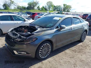 2017 Ford Fusion Titanium with VIN 3FA6P0K98HR124035, listed as a IAAI auction lot 42307936 with Not provided miles and . Bid and sale history available at DreamBid. Image 2.