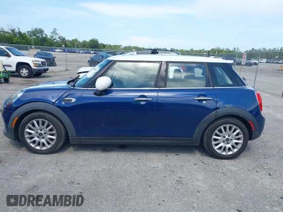 2015 MINI Hardtop 4 Door with VIN WMWXS5C51FT827510, listed as a IAAI auction lot 42365599 with 53,667 mi miles and . Bid and sale history available at DreamBid. Image 14.