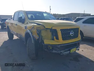 2016 Nissan Titan SL z VIN 1N6BA1F48GN500066, wystawiony jako IAAI lot #41857911 z przebiegiem 133 303 mil mil oraz . Historia ofert i sprzedaży dostępna na DreamBid. Obrazek 1.