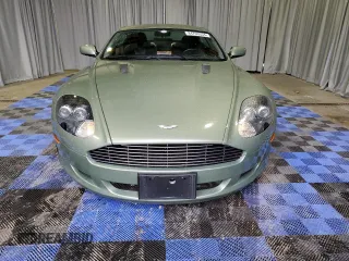 2005 Aston Martin DB9 z VIN SCFAD01A25GA00018, wystawiony jako Copart lot #84703534 z przebiegiem 19 831 mil mil oraz Tytuł czysty. Historia ofert i sprzedaży dostępna na DreamBid. Obrazek 5.