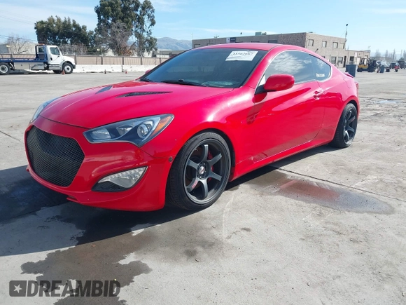 2013 Hyundai Genesis Coupe Track z VIN KMHHU6KJ4DU098623, wystawiony jako IAAI lot #41562667 z przebiegiem 120 690 mil mil oraz . Historia ofert i sprzedaży dostępna na DreamBid. Obrazek 2.