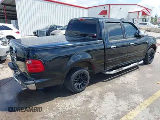 2003 Ford F-150 XLT with VIN 1FTRW07673KD87283, listed as a IAAI auction lot 42687687 with 339,160 mi miles and . Bid and sale history available at DreamBid. Image 4.