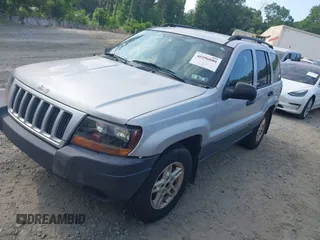 2004 Jeep Grand Cherokee Laredo z VIN 1J4GW48S54C106405, wystawiony jako IAAI lot #42315689 z przebiegiem 104 416 mil mil oraz . Historia ofert i sprzedaży dostępna na DreamBid. Obrazek 2.