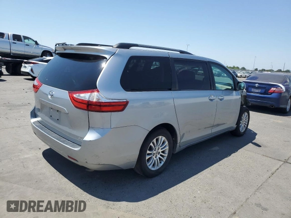 2015 Toyota Sienna XLE with VIN 5TDYK3DC4FS607026, listed as a Copart auction lot 60423605 with 132,327 mi miles and Clean title. Bid and sale history available at DreamBid. Image 3.