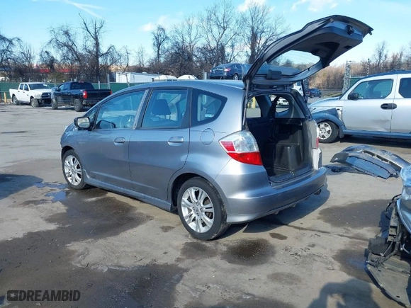2009 Honda Fit Sport w/Navi with VIN JHMGE88629S018457, listed as a IAAI auction lot 41431959 with 165,213 mi miles. Bid and sale history available at carsss.com. Image 3.