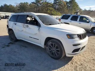 2018 Jeep Grand Cherokee High Altitude with VIN 1C4RJECG1JC125602, listed as a Copart auction lot 88702275 with 59,701 mi miles and Salvage title. Bid and sale history available at DreamBid. Image 4.