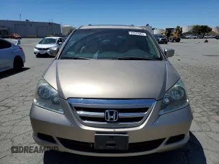2005 Honda Odyssey EX-L with VIN 5FNRL38625B045152, listed as a Copart auction lot 57633005 with 145,776 mi miles and Salvage title. Bid and sale history available at DreamBid. Image 5.
