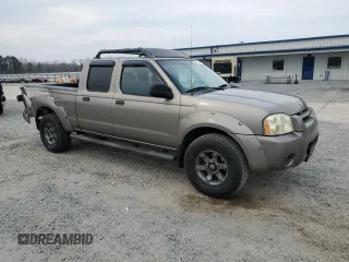 2004 Nissan Frontier XE with VIN 1N6ED29X64C478172, listed as a Copart auction lot 49031985 with 210,354 mi miles and Salvage title. Bid and sale history available at DreamBid. Image 4.