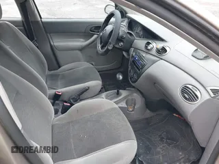 2003 Ford Focus LX with VIN 1FAFP33P33W267575, listed as a IAAI auction lot 41804406 with 106,957 mi miles and . Bid and sale history available at carsss.com. Image 5.