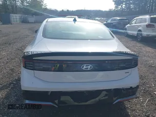 2024 Hyundai Sonata SEL z VIN KMHL64JA4RA395863, wystawiony jako IAAI lot #41801732 z przebiegiem 3 034 mil mil oraz . Historia ofert i sprzedaży dostępna na DreamBid. Obrazek 16.