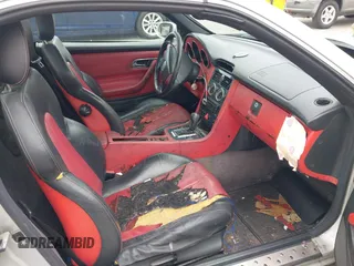 1998 Mercedes-Benz SLK 230/320 z VIN WDBKK47F0WF020242, wystawiony jako IAAI lot #41913424 z przebiegiem Nie podano mil oraz . Historia ofert i sprzedaży dostępna na DreamBid. Obrazek 8.