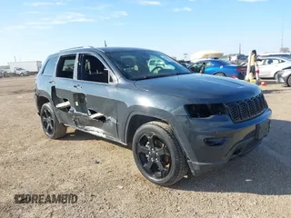 2018 Jeep Grand Cherokee Laredo E with VIN 1C4RJFAG4JC370502, listed as a IAAI auction lot 41342367 with 104,307 mi miles. Bid and sale history available at carsss.com. Image 1.