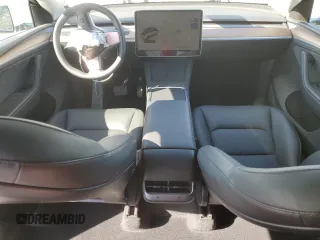 2025 Tesla Model Y Long Range with VIN 7SAYGDED2SA373756, listed as a Copart auction lot 49866835 with 3,318 mi miles and Salvage Title. Bid and sale history available at DreamBid. Image 8.
