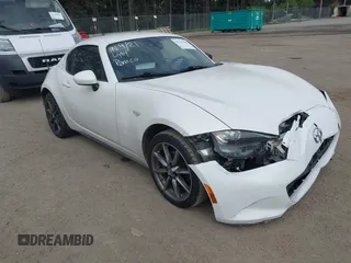 2020 Mazda MX-5 Miata Grand Touring with VIN JM1NDAM75L0411647, listed as a IAAI auction lot 42213306 with 65,928 mi miles and . Bid and sale history available at DreamBid. Image 1.