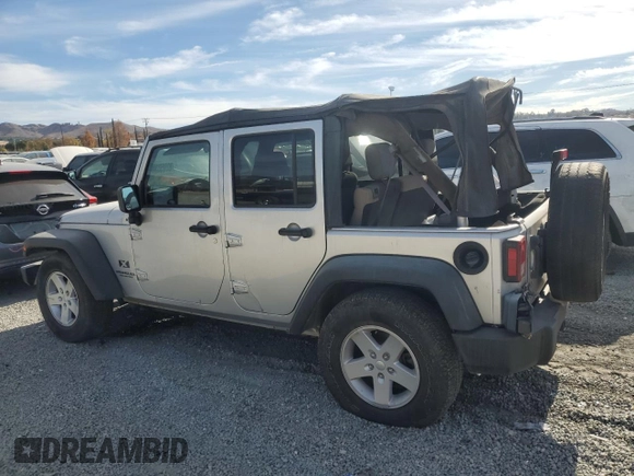 2007 Jeep Wrangler Unlimited X with VIN 1J8GB39157L142982, listed as a Copart auction lot 82050134 with 72,666 mi miles and Salvage Title. Bid and sale history available at DreamBid. Image 2.