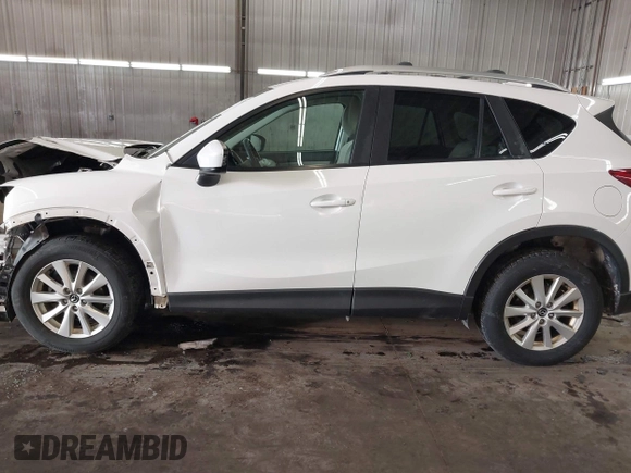 2014 Mazda CX-5 Touring with VIN JM3KE4CY4E0321055, listed as a IAAI auction lot 41613593 with 174,339 mi miles. Bid and sale history available at carsss.com. Image 15.
