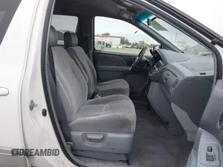 1999 Toyota Sienna LE with VIN 4T3ZF13C2XU105212, listed as a IAAI auction lot 42066557 with 153,659 mi miles. Bid and sale history available at carsss.com. Image 5.